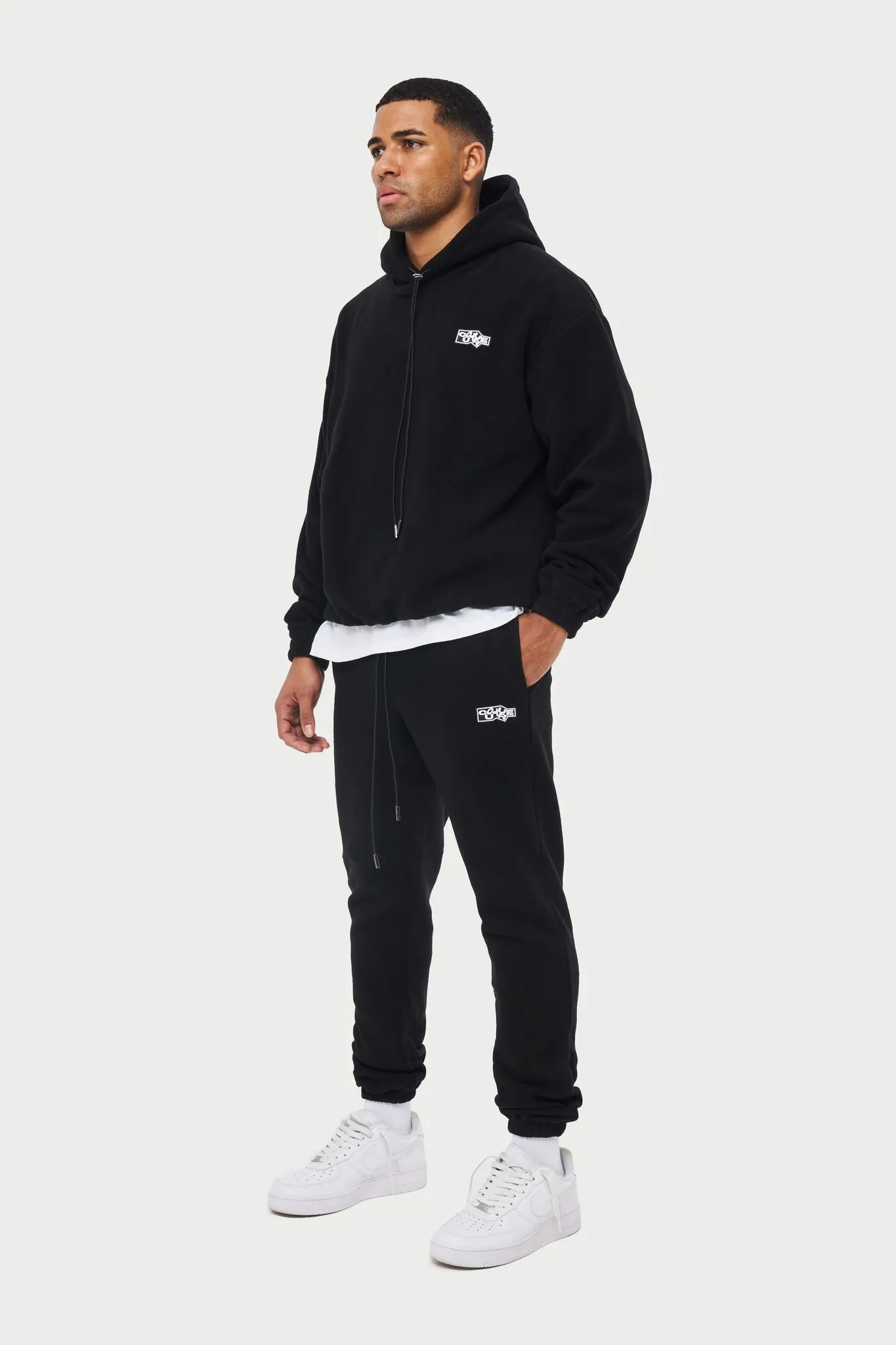 POLAR FLEECE RUBBER BADGE TRACKSUIT JOGGERS - BLACK