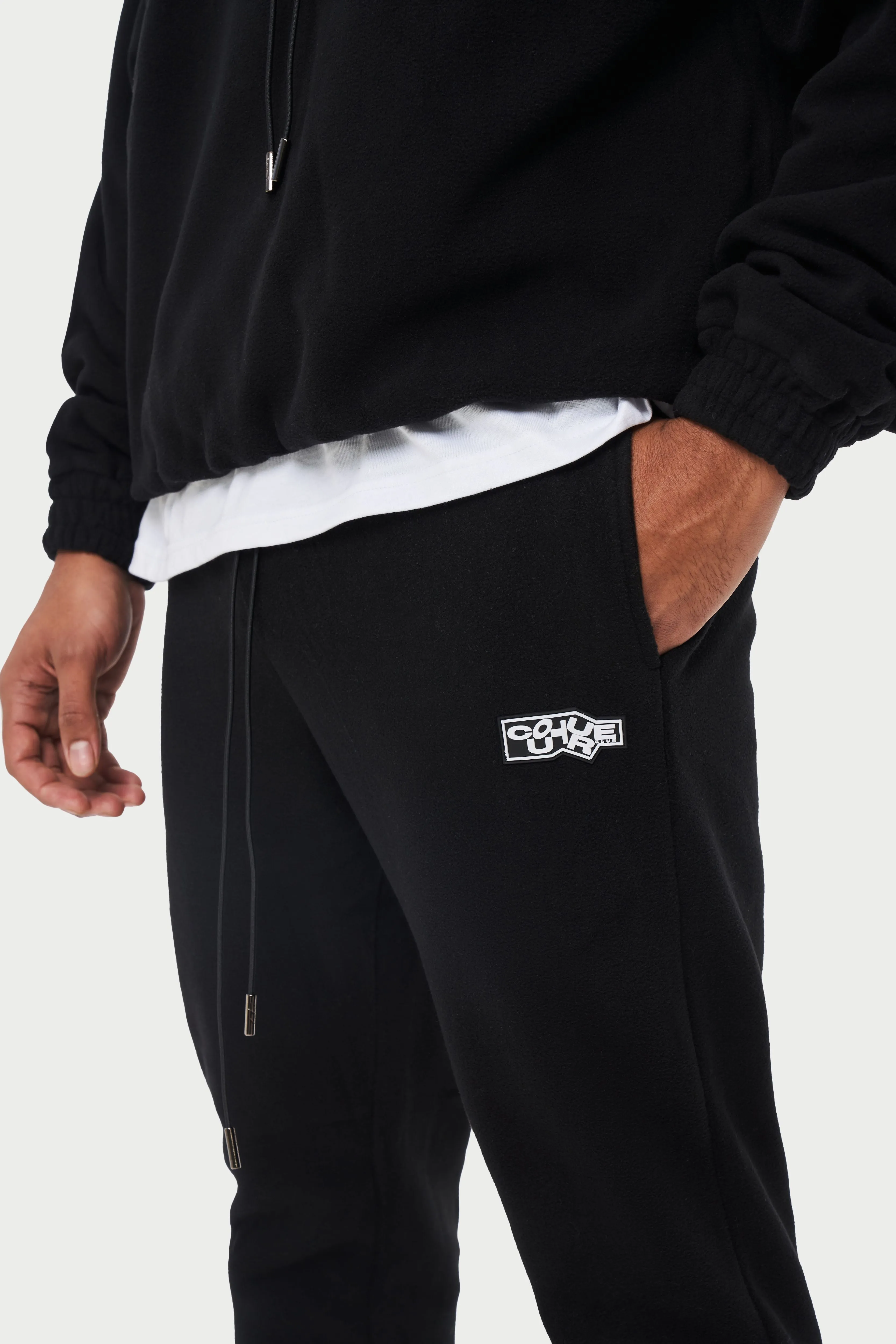 POLAR FLEECE RUBBER BADGE TRACKSUIT JOGGERS - BLACK